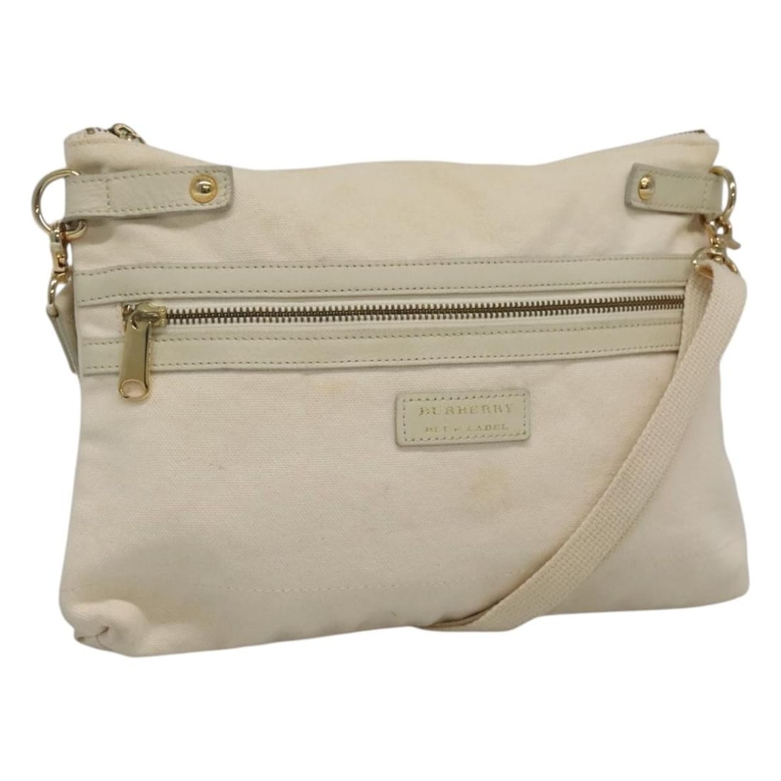 Burberry Blue Label Canvas Shoulder Handbag in Beige: Burberry Blue Label Canvas Shoulder Handbag in Beige This Burberry Blue Label shoulder bag features a beige canvas exterior and is designed for women. The bag shows significant signs of use, including