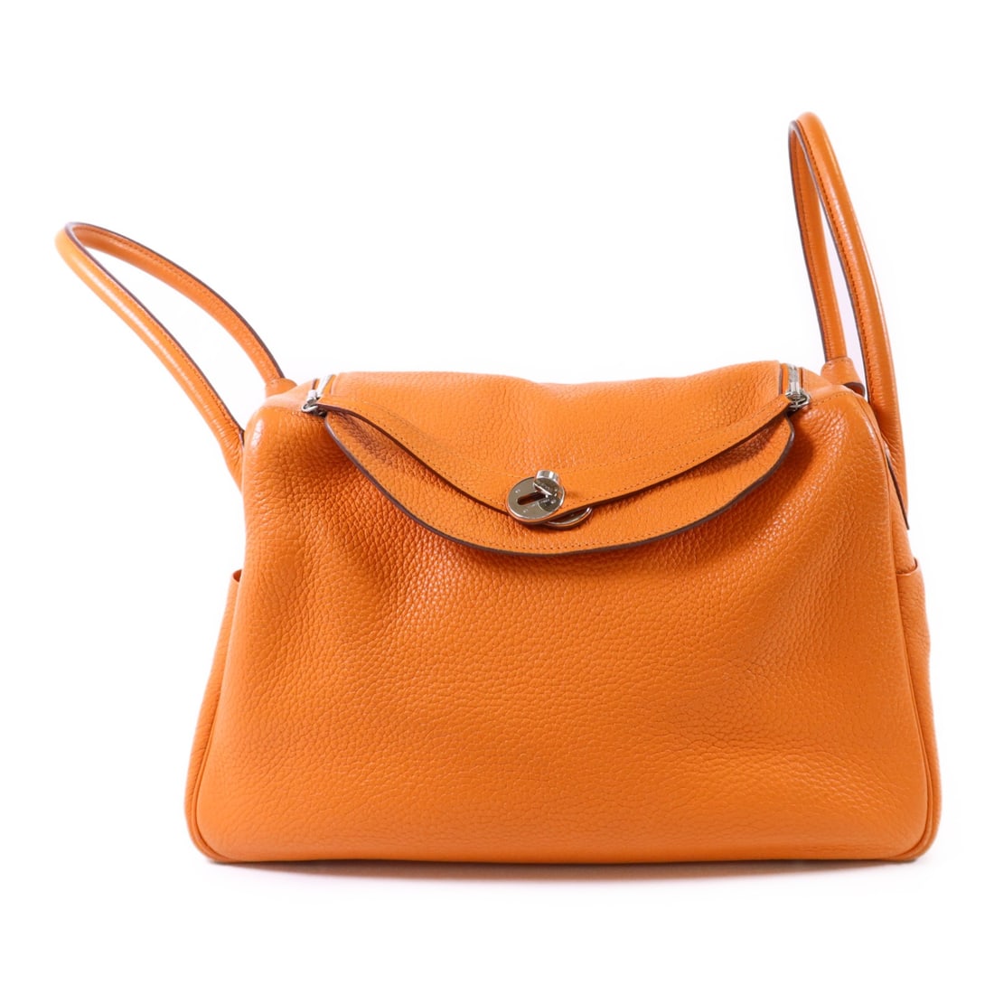 Hermes Lindy 34 Orange Clemence Leather Shoulder Bag with Palladium Hardware: Hermes Lindy 34 Orange Clemence Leather Shoulder Bag with Palladium Hardware This Hermes Lindy 34 is a versatile 2-way shoulder handbag crafted from Clemence leather in a vibrant orange color. It feat