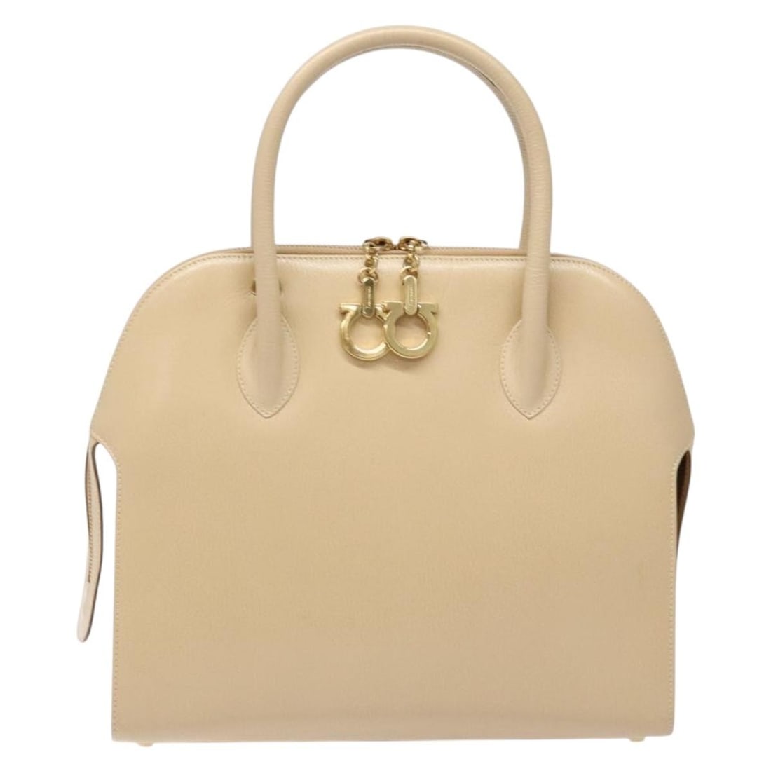 Convertible Dome Gancini Beige Leather Bag by Salvatore Ferragamo: Convertible Dome Gancini Beige Leather Bag by Salvatore Ferragamo This Salvatore Ferragamo Convertible Dome Gancini handbag is crafted from beige leather and designed for women. The bag features metal