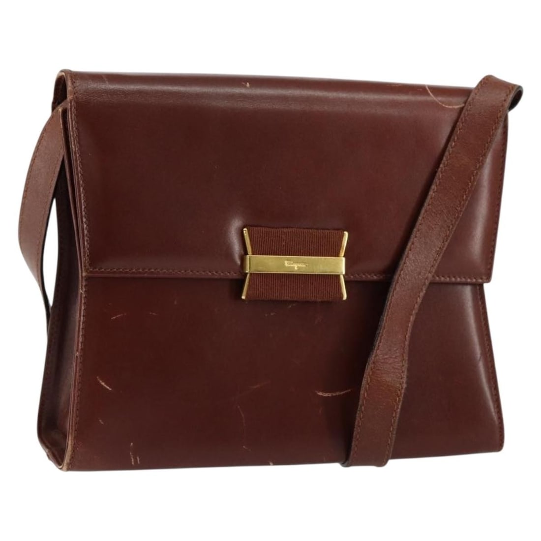 Salvatore Ferragamo Brown Leather Shoulder Bag Gold Accents BA8006: Salvatore Ferragamo Brown Leather Shoulder Bag Gold Accents BA8006 This exquisite Salvatore Ferragamo Shoulder Bag is crafted from high-quality leather in an elegant brown and gold color combination, 
