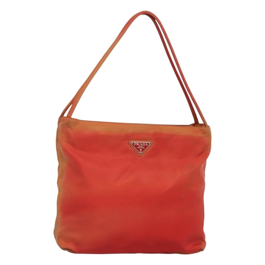 Prada Red Nylon Tote with Guarantee Card: Prada Red Nylon Tote with Guarantee Card This PRADA tote bag is crafted from red nylon and features a spacious design suitable for daily use. Made in Italy, it offers a comfortable handle drop and com