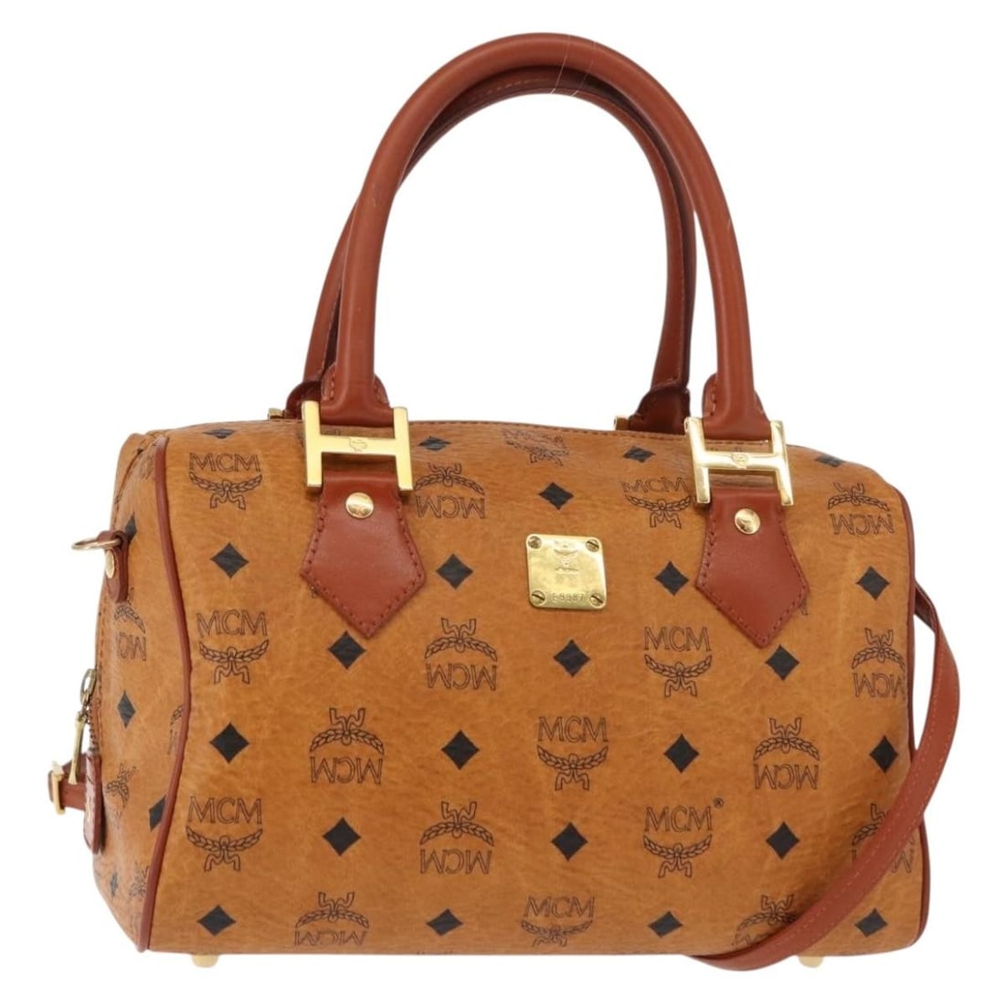 MCM Vicetos Logogram Hand Bag PVC Leather Brown Gold Authentic BA5195: MCM Vicetos Logogram Hand Bag PVC Leather Brown Gold Authentic BA5195 This MCM Vicetos Logogram Hand Bag is a stylish accessory crafted from durable PVC leather, featuring a sophisticated brown and go