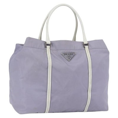PRADA Purple Silver Nylon Leather Backpack Italy: PRADA Purple Silver Nylon Leather Backpack Italy This PRADA backpack is crafted from purple nylon with silver-tone accents and leather detailing. Made in Italy, it features a spacious main compartment