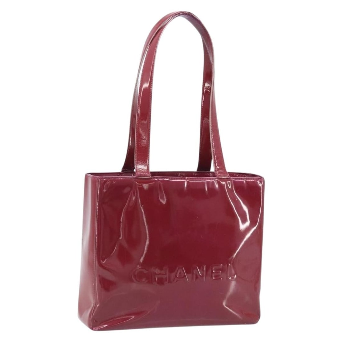 Red Patent Leather CHANEL Tote with Gold CC Logo and Guarantee Card: Red Patent Leather CHANEL Tote with Gold CC Logo and Guarantee Card This CHANEL tote bag is crafted from red patent leather with gold-tone accents and features the signature CC detail. Designed for wo