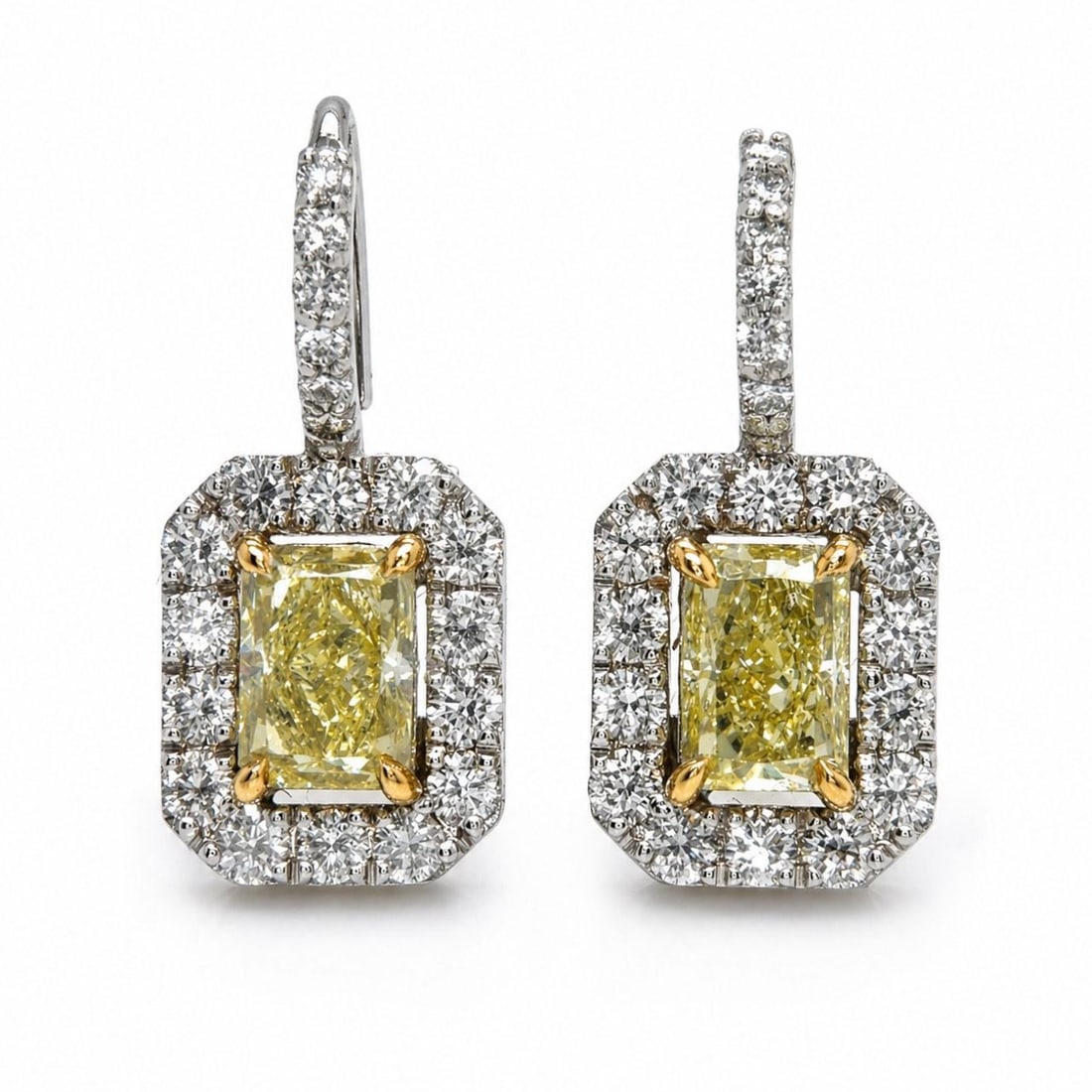 18K White Gold Earrings With GIA Fancy Yellow Radiant Diamonds: 18K White Gold Earrings With GIA Fancy Yellow Radiant Diamonds These 18K white gold earrings feature two GIA certified radiant-cut fancy yellow diamonds, one weighing 1.13 ct with VS1 clarity and the 