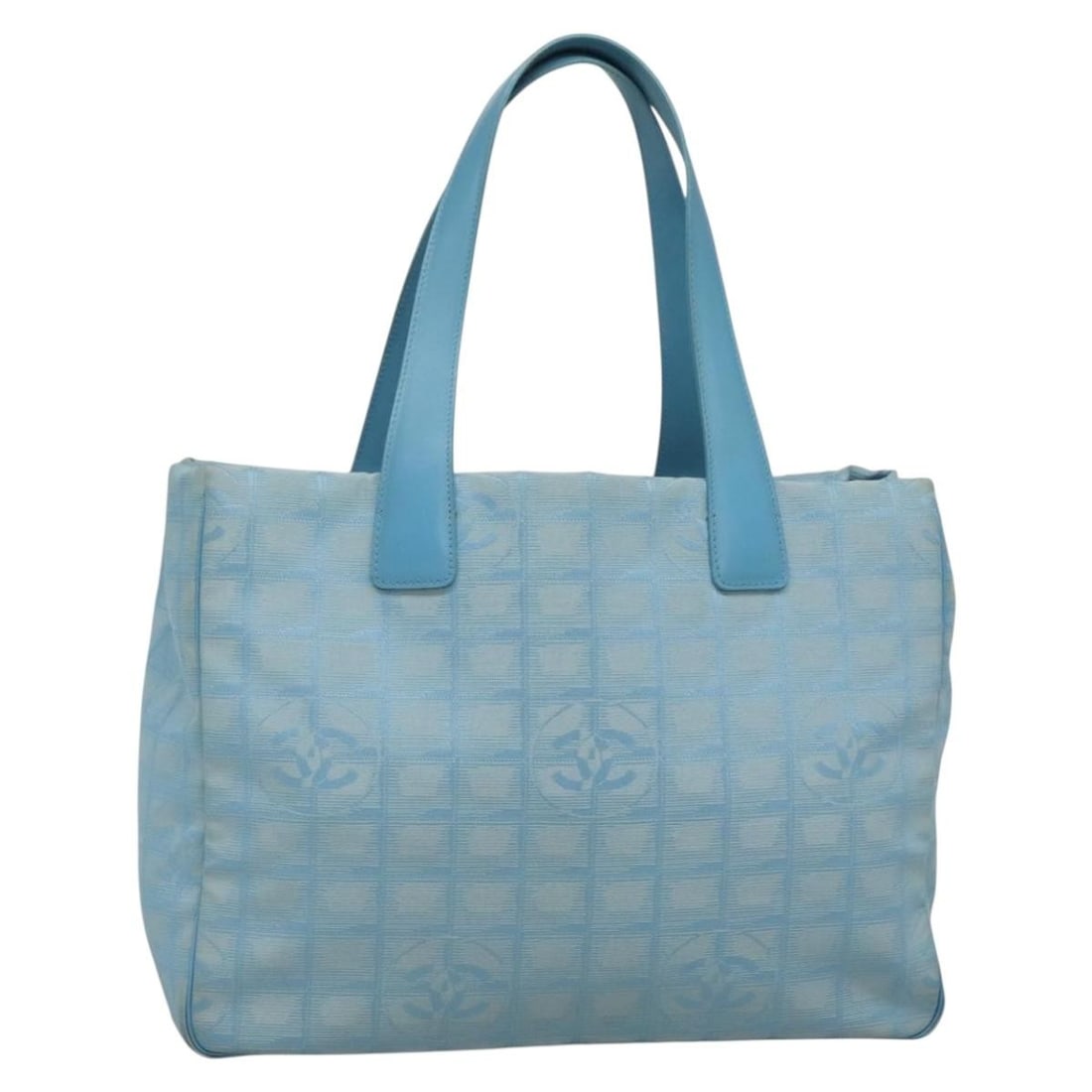 Light Blue Nylon Tote with Silver CC Logo by Chanel New Travel Line: Light Blue Nylon Tote with Silver CC Logo by Chanel New Travel Line This CHANEL New Travel Line tote bag is crafted from light blue nylon with silver-tone accents. Designed for women, it features a sp