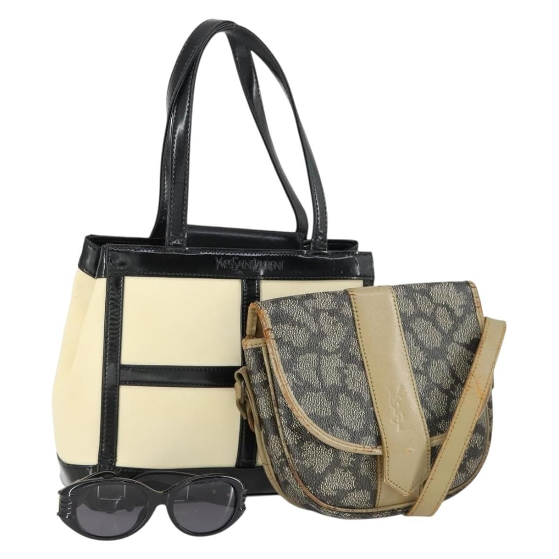 Set of 3 Saint Laurent Black and White Nylon Shoulder Bags: Set of 3 Saint Laurent Black and White Nylon Shoulder Bags This is a set of three Saint Laurent shoulder bags in black and white, crafted from nylon with PVC plastic elements. Made in Italy, these bag