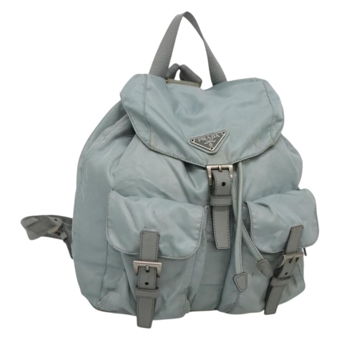 Prada nylon light blue silver backpack with guarantee card: Prada nylon light blue silver backpack with guarantee card This PRADA backpack is crafted from light blue nylon with silver-tone accents and is designed for women. Made in Italy, it features a spaciou