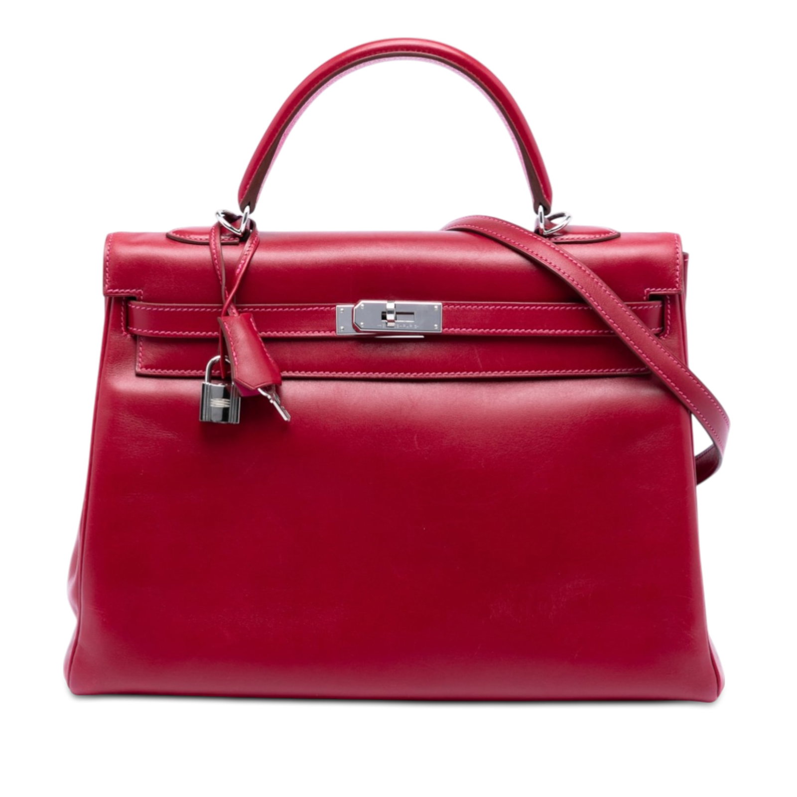 Hermes Kelly II Retourne 35 Tadelakt Leather Handbag in Rubis and Rose Tyrien: Hermes Kelly II Retourne 35 Tadelakt Leather Handbag in Rubis and Rose Tyrien The Hermes Tadelakt Verso Kelly II Retourne 35 is crafted from Tadelakt leather in Rubis color with a contrasting Rose Tyr