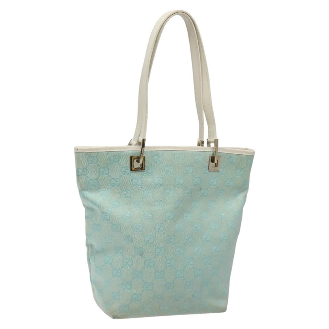 Light Blue and Gold GG Canvas Tote by Gucci 002 1099: Light Blue and Gold GG Canvas Tote by Gucci 002 1099 This GUCCI GG Canvas tote bag features a light blue and gold color scheme and is crafted from GG canvas with leather trim. Designed for women, the 