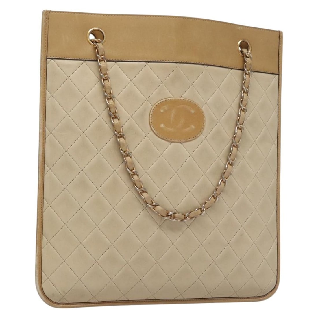 Beige Lambskin Matelasse Handbag with Chain Strap by CHANEL Gold CC: Beige Lambskin Matelasse Handbag with Chain Strap by CHANEL Gold CC This CHANEL Matelasse chain handbag is crafted from lambskin in a beige color with gold-tone accents. Designed for women, it feature
