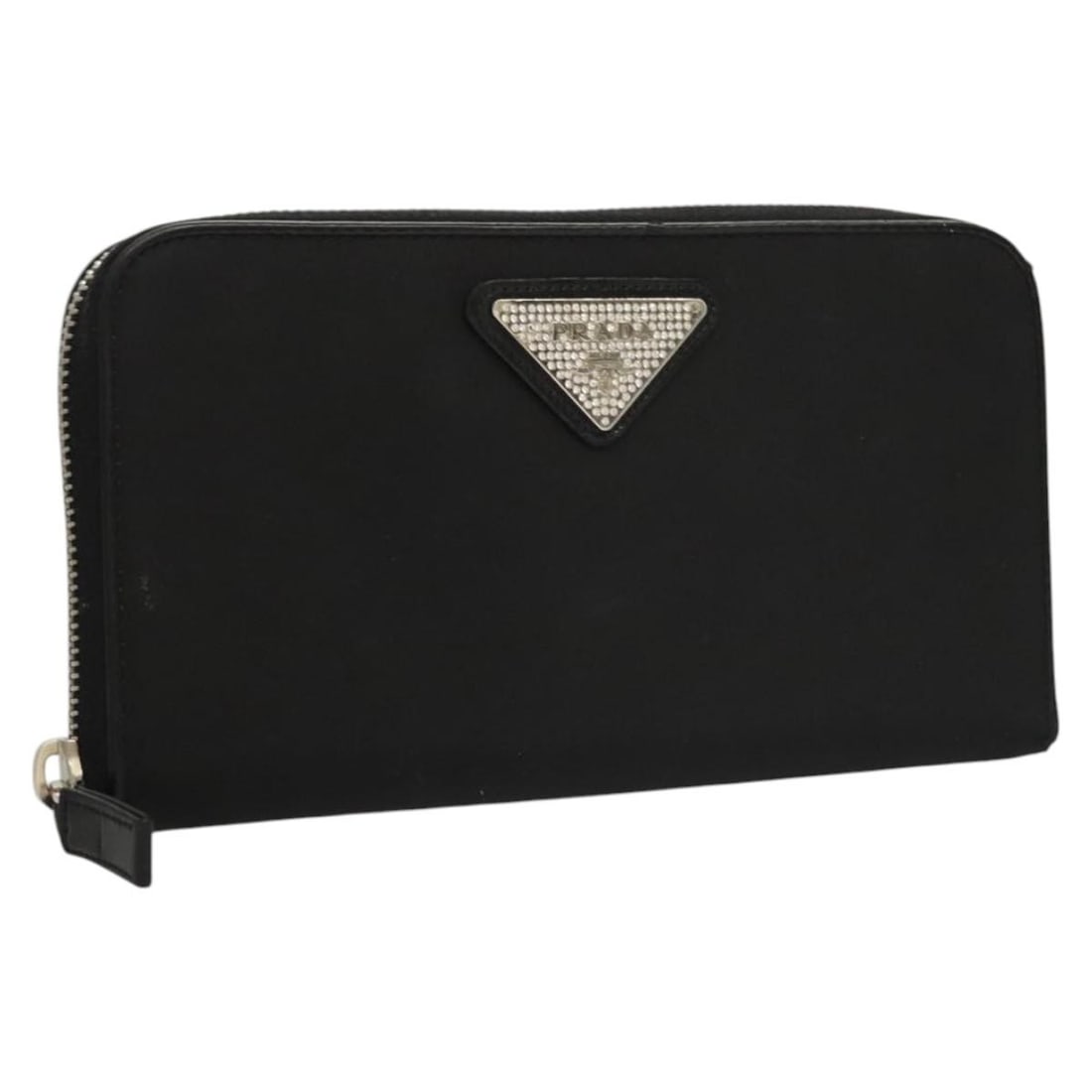 Black Nylon Long Wallet for Women by PRADA Italy: Black Nylon Long Wallet for Women by PRADA Italy This PRADA long wallet is crafted from black nylon and designed for women. It features a spacious interior and a sleek, elongated silhouette. The walle