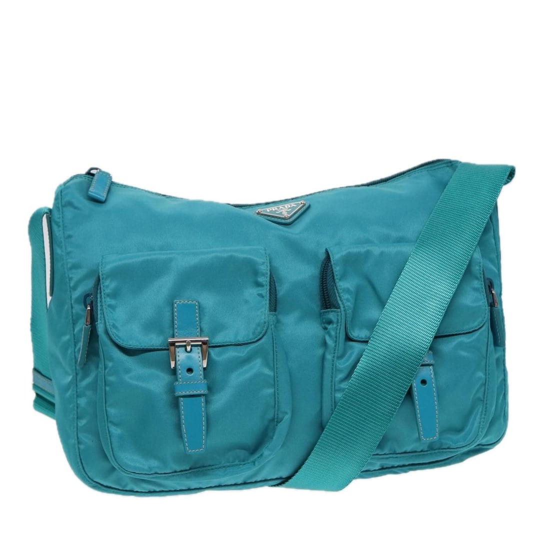 Prada Turquoise Blue Nylon Women's Shoulder Bag with Dust Bag: Prada Turquoise Blue Nylon Women's Shoulder Bag with Dust Bag This PRADA shoulder bag features a turquoise blue nylon exterior, offering a stylish and practical accessory for women. The bag is made in