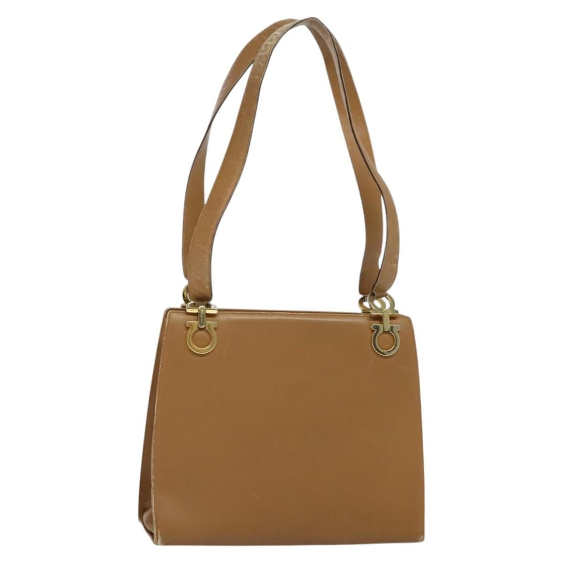 Beige Leather Gancini Shoulder Bag by Salvatore Ferragamo Italy: Beige Leather Gancini Shoulder Bag by Salvatore Ferragamo Italy This Salvatore Ferragamo Gancini shoulder bag is crafted from beige leather with gold-tone accents, designed for women. The bag features