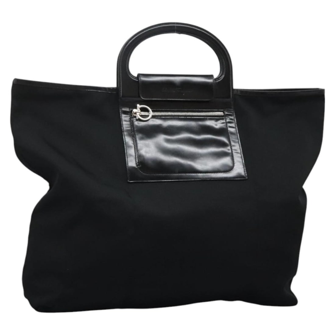 Salvatore Ferragamo Black Nylon Gancini Handbag Italy: Salvatore Ferragamo Black Nylon Gancini Handbag Italy This Salvatore Ferragamo Gancini handbag is crafted from black nylon and made in Italy. The bag features a spacious design with approximate dimens