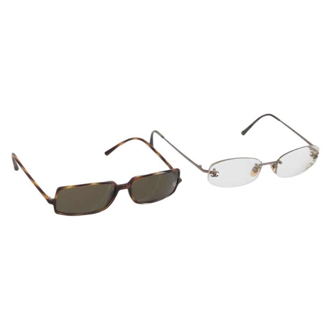 Set of 2 Brown Plastic Glasses for Women by CHANEL: Set of 2 Brown Plastic Glasses for Women by CHANEL This is a set of two CHANEL women's glasses crafted from brown plastic. The glasses show signs of heavy use, including rubbing and scratches on the s