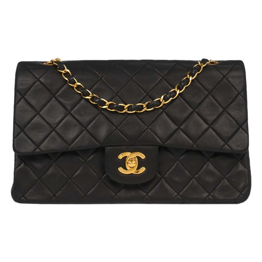 Black Lambskin Quilted Double Flap Vintage Bag by Chanel: Black Lambskin Quilted Double Flap Vintage Bag by Chanel This Chanel Vintage Classic Double Flap Bag is crafted from black quilted leather and designed for women. The bag features the iconic double fl