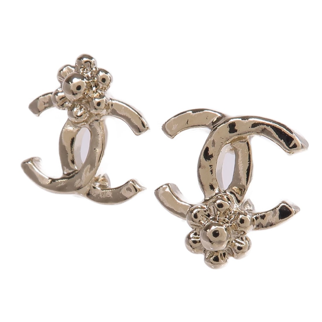 Gold Metal Pierced Earrings by CHANEL with CC Logo: Gold Metal Pierced Earrings by CHANEL with CC Logo These CHANEL CC pierced earrings feature a gold tone finish and are crafted from metal. Made in France, they showcase the iconic CC logo and are desi
