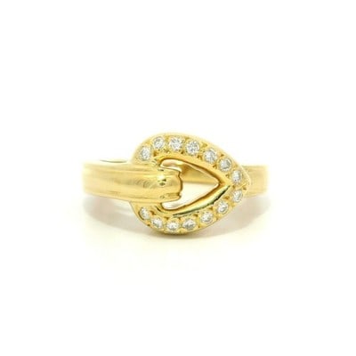 Diamond Heart Buckle 18k Yellow Gold Band Ring: Diamond Heart Buckle 18k Yellow Gold Band Ring This elegant band ring is crafted from solid 18k yellow gold and features a heart buckle design adorned with approximately 0.12 carats total weight of ro