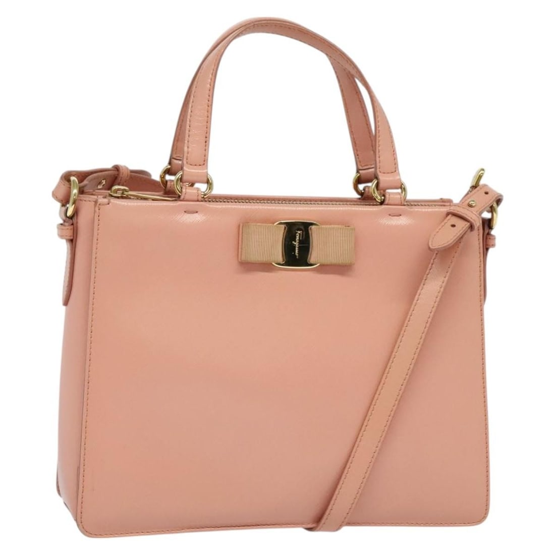 Salvatore Ferragamo Vala Leather Hand Bag Pink Gold Made in Italy: Salvatore Ferragamo Vala Leather Hand Bag Pink Gold Made in Italy This Salvatore Ferragamo Vala Hand Bag is a stylish accessory crafted from premium leather, featuring a chic pink and gold exterior. D