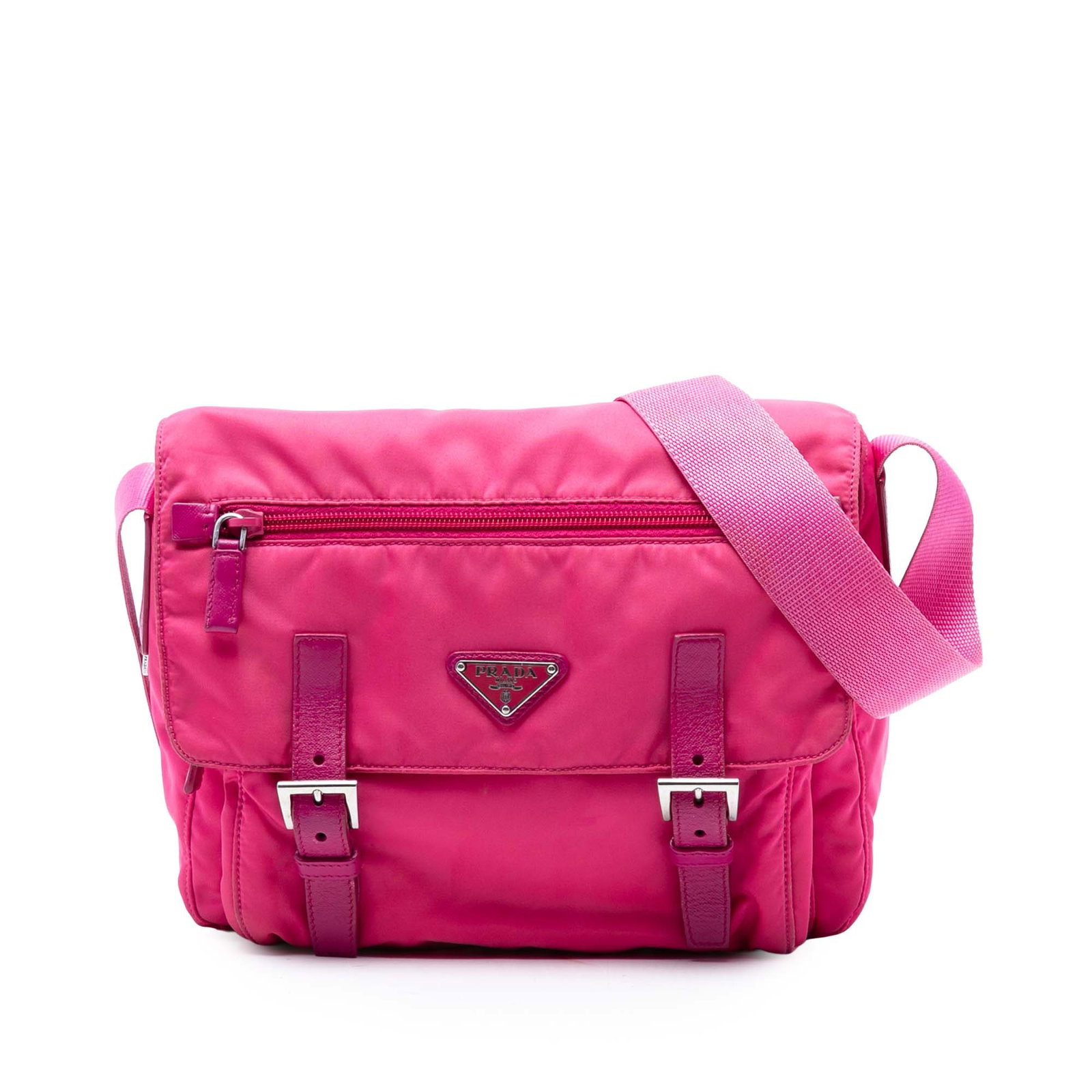 Prada Tessuto Pink Nylon Crossbody Bag with Double Buckle and Zip Pockets: Prada Tessuto Pink Nylon Crossbody Bag with Double Buckle and Zip Pockets This Prada Tessuto Zip Double Buckle Messenger Bag features a pink nylon body with an adjustable shoulder strap. The design in