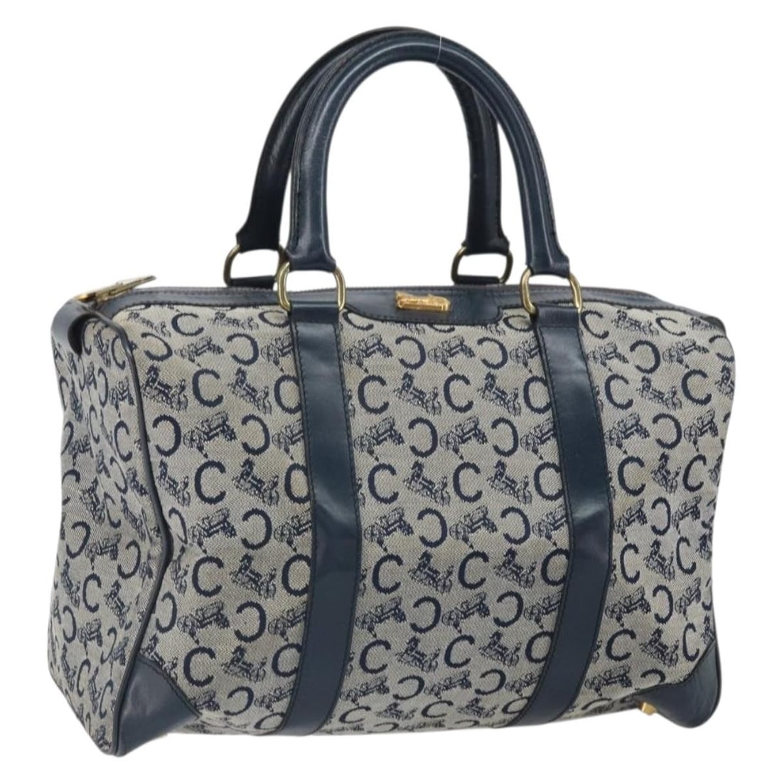Celine Sulky Canvas Boston Bag in Navy and Gold Tone Hardware: Celine Sulky Canvas Boston Bag in Navy and Gold Tone Hardware This CELINE C Sulky Boston Bag features a navy and gold canvas exterior with a classic Boston bag silhouette. Crafted in France, it offers