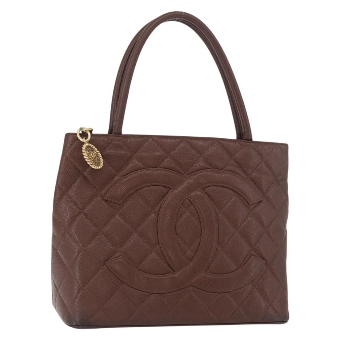 CHANEL brown gold caviar skin tote bag reissue auth: CHANEL brown gold caviar skin tote bag reissue auth This CHANEL Reissue tote bag is crafted from durable caviar skin leather in a brown and gold color combination. The bag features gold-tone CC hardwa