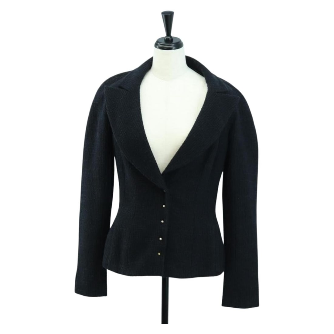 Black Wool Tweed Jacket by CHANEL for Men Made in France: Black Wool Tweed Jacket by CHANEL for Men Made in France This CHANEL tweed jacket is crafted from black wool and designed for men. It features a classic silhouette with approximate measurements provid