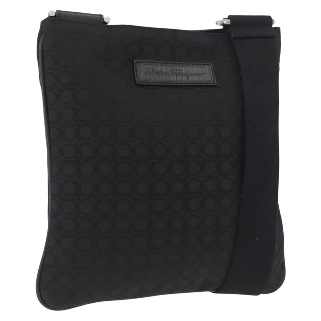 Black Canvas Shoulder Purse by Salvatore Ferragamo with Silver Accents: Black Canvas Shoulder Purse by Salvatore Ferragamo with Silver Accents This Salvatore Ferragamo shoulder bag for women features a black and silver canvas exterior with silver-tone hardware. The bag is