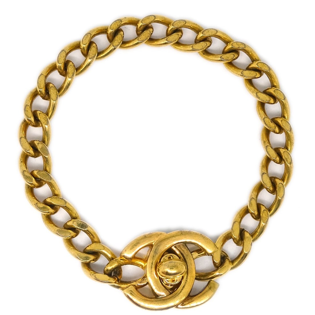 Chanel Gold-Plated Turnlock Bracelet 99A: Chanel Gold-Plated Turnlock Bracelet 99A This elegant Chanel Turnlock Bracelet is a stunning piece that showcases timeless fashion. Crafted from high-quality gold-plated metal, this bracelet features 