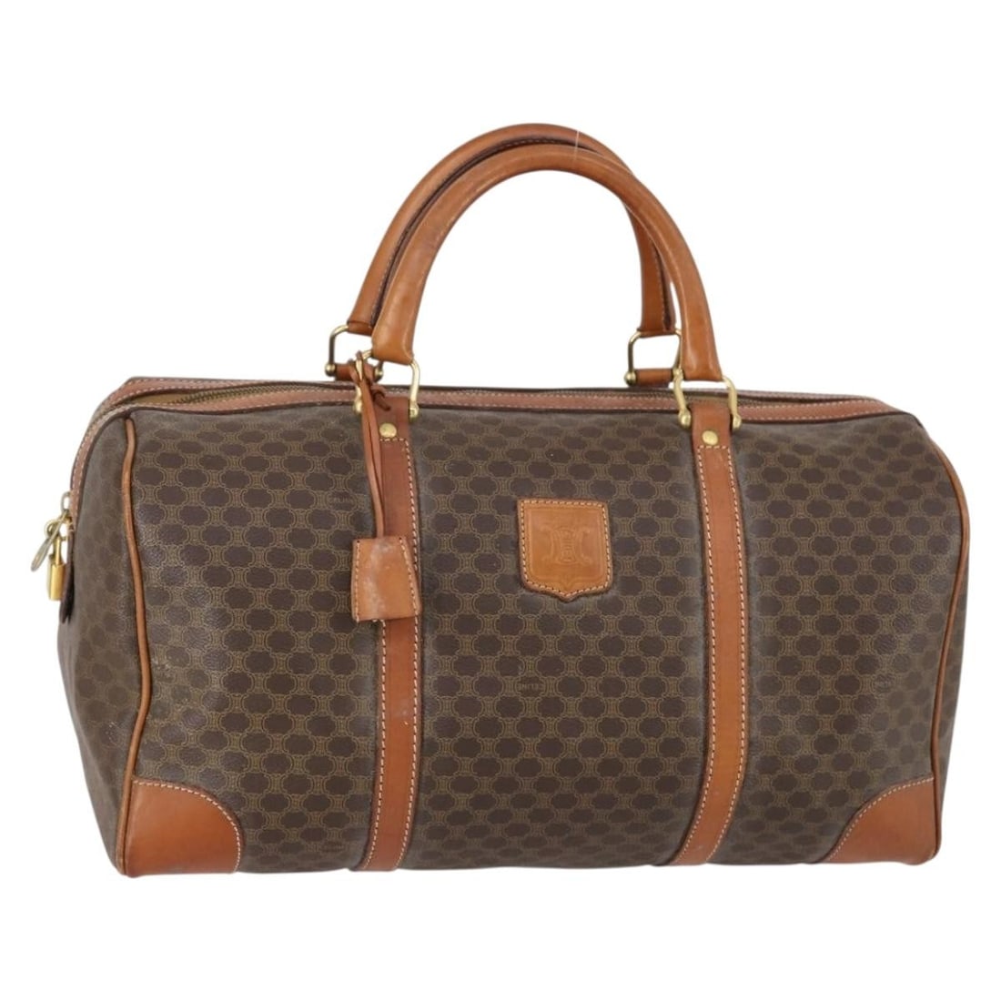 CELINE Macadam Canvas Brown Gold Boston Bag with Padlock: CELINE Macadam Canvas Brown Gold Boston Bag with Padlock This Celine Macadam Canvas Boston Bag is a stylish accessory crafted from durable PVC leather with a chic brown and gold color scheme. The bag 
