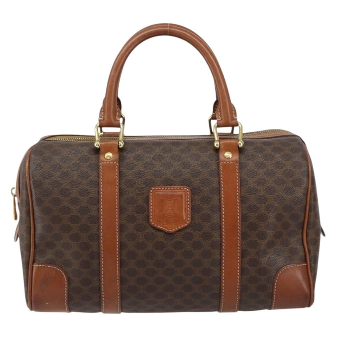 Brown Canvas Boston Handbag by Celine Macadam Vintage Collection: Brown Canvas Boston Handbag by Celine Macadam Vintage Collection This is a Celine Vintage Macadam Boston bag crafted from brown canvas. Designed for women, the bag features leather accents and metal f