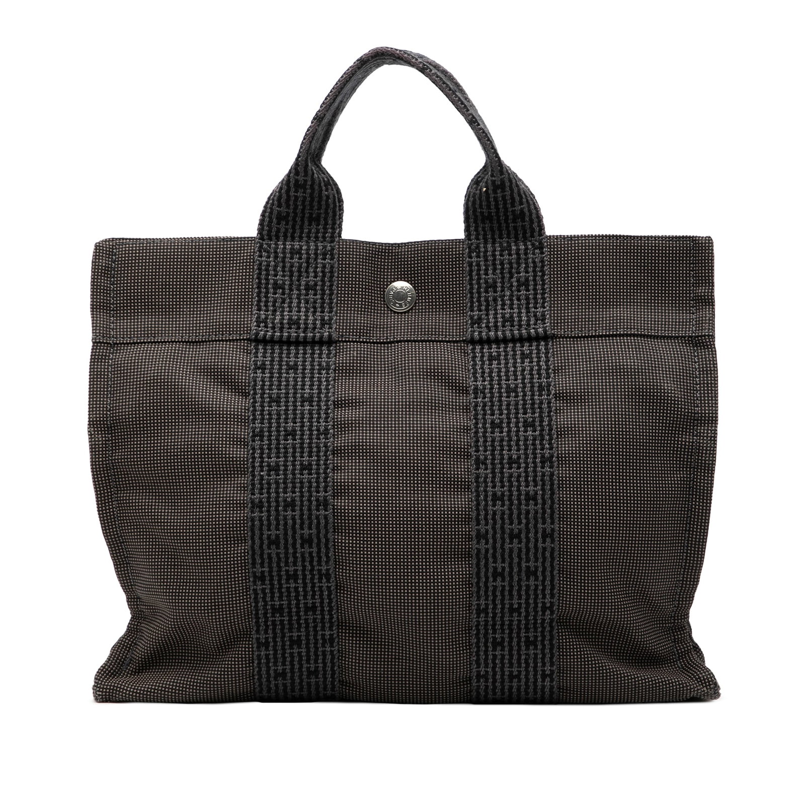 Herline PM gray canvas tote bag by Hermes with snap closure: Herline PM gray canvas tote bag by Hermes with snap closure The Hermes Herline PM is crafted from durable gray canvas and features flat straps, an open top with a snap closure, and an interior zip com