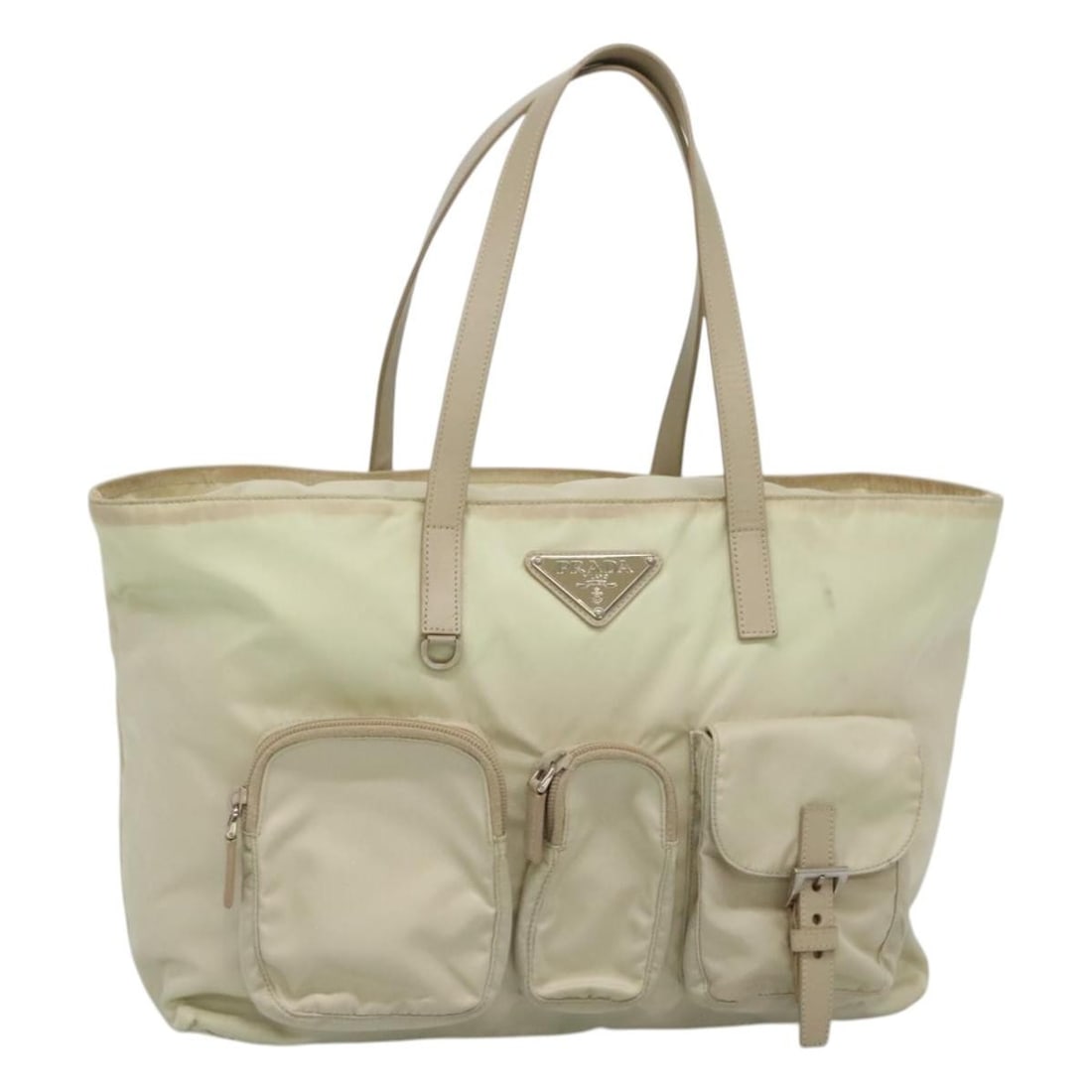 Prada Ivory Silver Nylon Tote Bag Italy 35cm x 25cm x 12cm: Prada Ivory Silver Nylon Tote Bag Italy 35cm x 25cm x 12cm This PRADA tote bag is crafted from durable nylon in an ivory and silver color scheme. Designed for women, it features a spacious interior wi