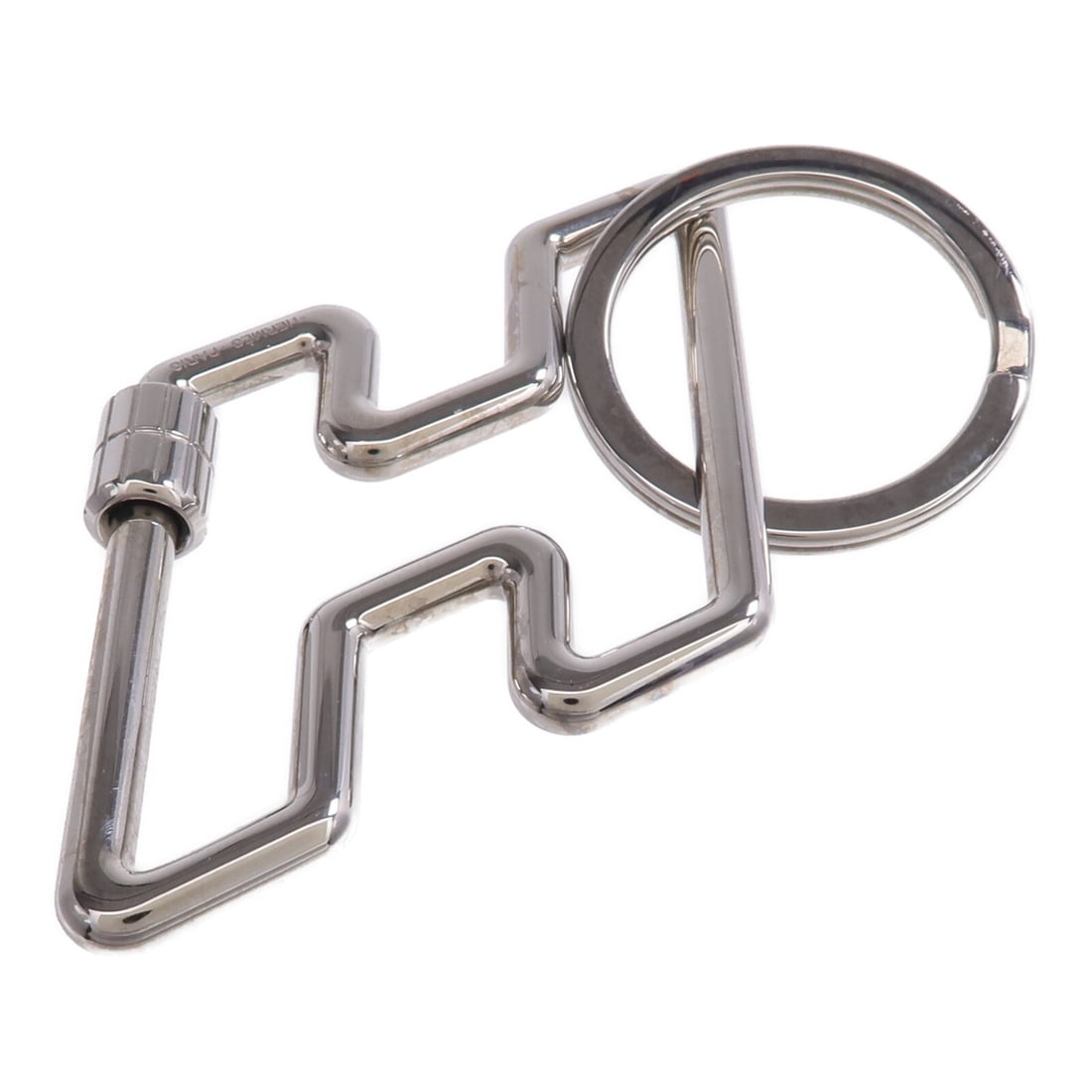 Hermes H Too Speed Silver Metal Key Ring: Hermes H Too Speed Silver Metal Key Ring This Hermes H Too Speed key ring features a sleek silver-tone design crafted from metal. Designed for women, it offers a stylish and practical accessory for or