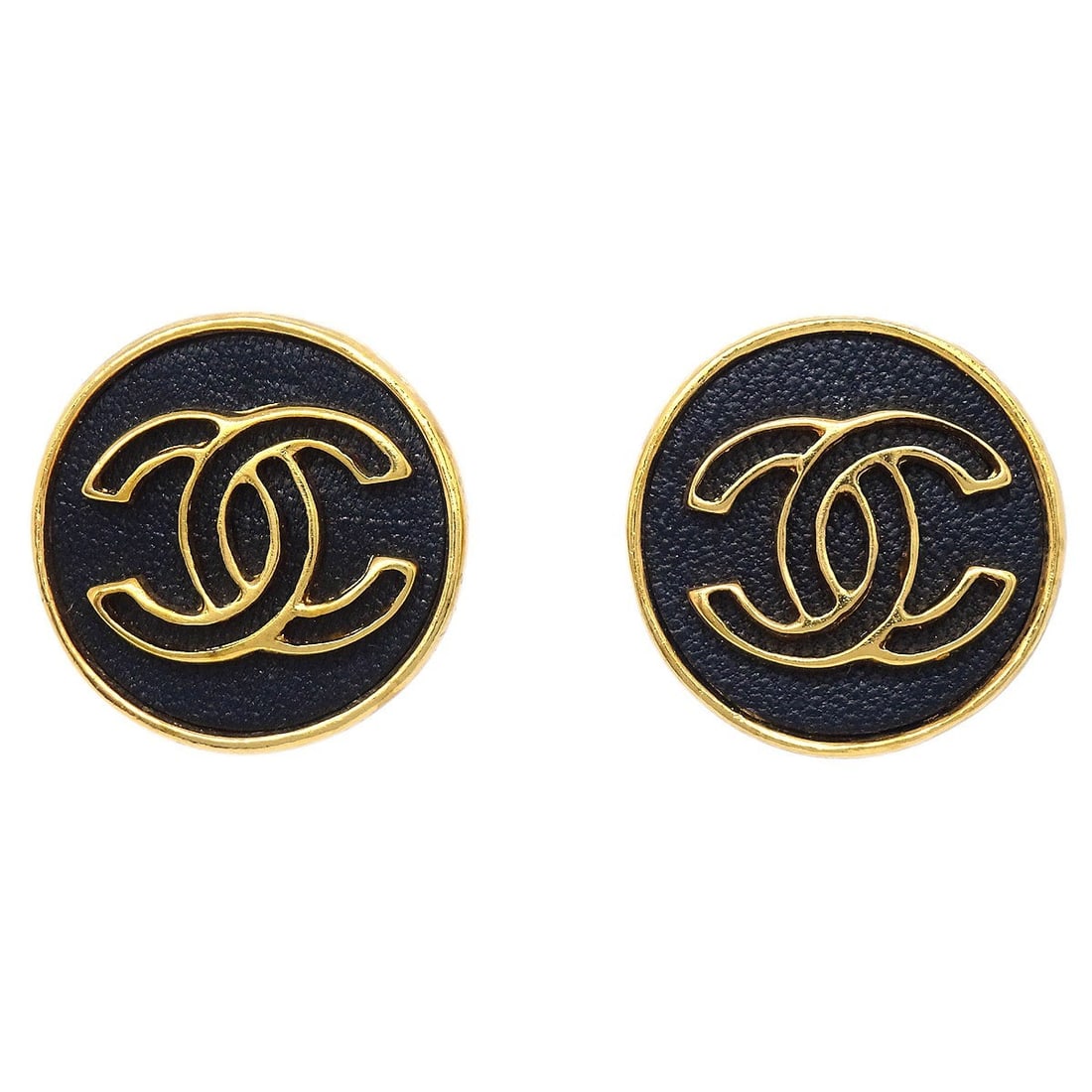 Black and Gold Clip-On Button Earrings by Chanel 03P: Black and Gold Clip-On Button Earrings by Chanel 03P These Chanel button-style clip-on earrings feature a round shape with a striking black and gold color combination. Crafted from gold-plated materia