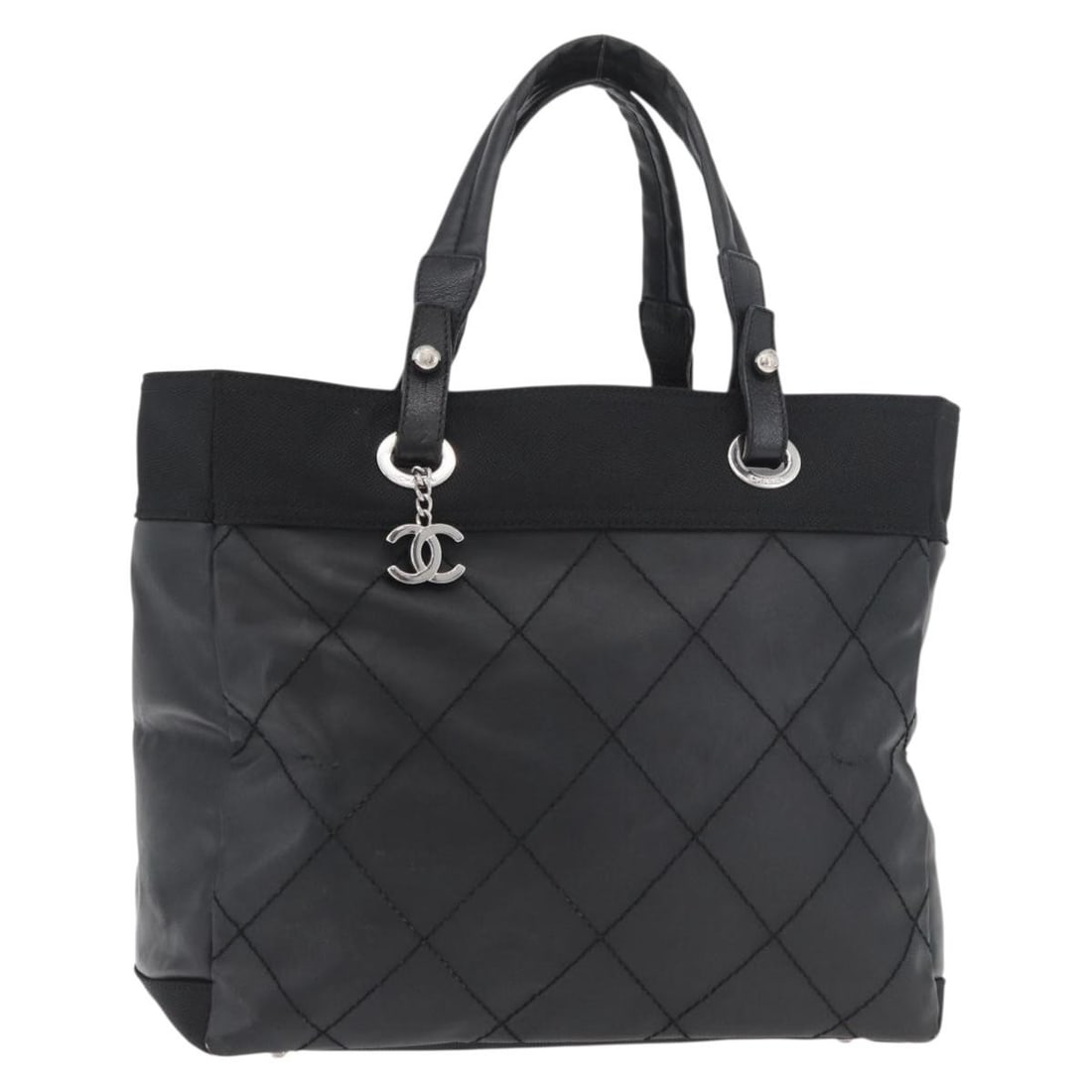 CHANEL Biarritz Black Silver Tote Bag Coated Canvas Italy: CHANEL Biarritz Black Silver Tote Bag Coated Canvas Italy This CHANEL Paris Biarritz tote bag is crafted from coated canvas in black and silver tones. Designed for women, the bag features a spacious i