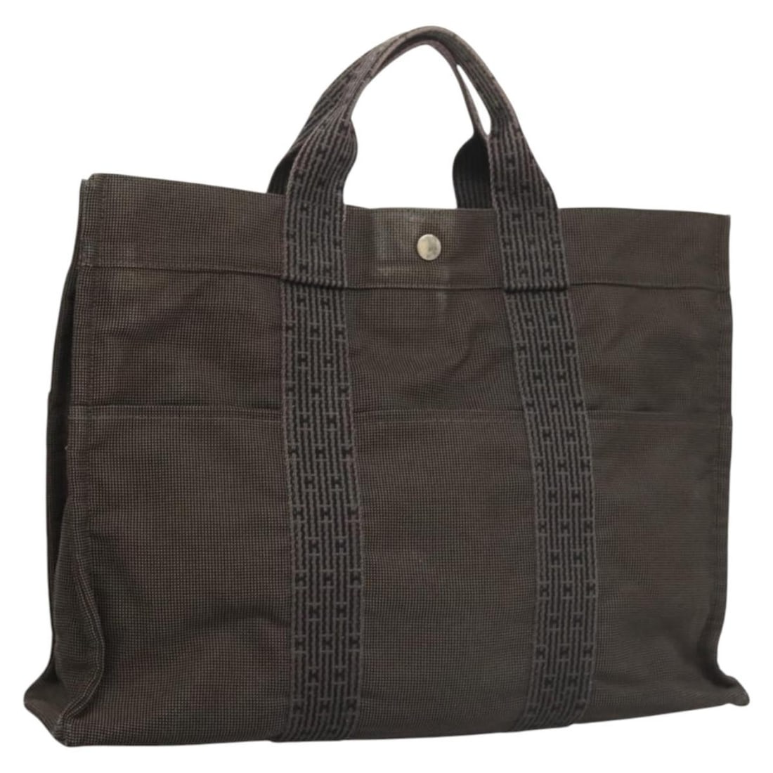 Hermes Her Line MM Gray Canvas Tote Bag with Padlock: Hermes Her Line MM Gray Canvas Tote Bag with Padlock This Hermes Her Line MM tote bag features a gray and silver canvas exterior, designed for women. The bag includes a padlock accessory but is missin