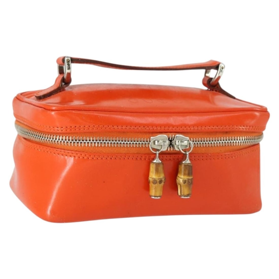 Gucci Bamboo Orange Patent Leather Vanity Handbag with Silver Tone Hardware: Gucci Bamboo Orange Patent Leather Vanity Handbag with Silver Tone Hardware This GUCCI Bamboo Vanity hand bag features a striking orange patent leather exterior accented with silver-tone elements. Des