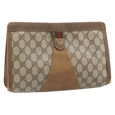 Gucci Sherry Line GG Supreme Beige Gold Clutch Bag: Gucci Sherry Line GG Supreme Beige Gold Clutch Bag This GUCCI GG Supreme Web Sherry Line clutch bag is crafted from beige and gold PVC leather combined with GG canvas. The bag features a classic clutc