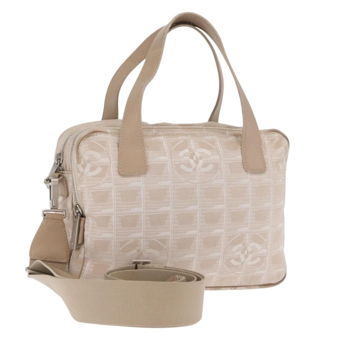 Beige Nylon CHANEL New Travel Line Two Way Handbag with Shoulder Strap: Beige Nylon CHANEL New Travel Line Two Way Handbag with Shoulder Strap This CHANEL Travel Line 2-way handbag is crafted from beige and silver nylon and features both top handles and a detachable shoul