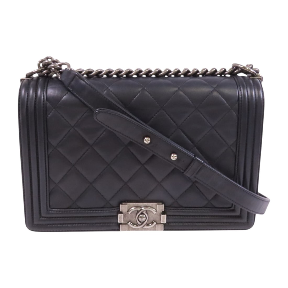CHANEL Black Boy 28 Shoulder Bag with Silver Hardware: CHANEL Black Boy 28 Shoulder Bag with Silver Hardware Introducing the CHANEL Boy 28 Chain Shoulder Bag, a stylish and sophisticated accessory crafted from premium black calfskin leather. This shoulder