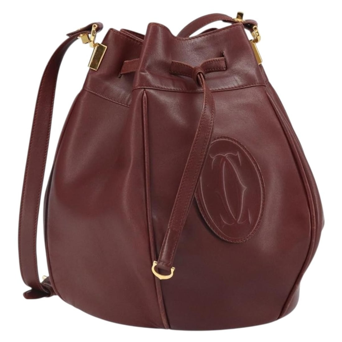 Cartier Must Line Bordeaux Leather Shoulder Bag with Gold Accents: Cartier Must Line Bordeaux Leather Shoulder Bag with Gold Accents This is a Cartier Must Line shoulder bag crafted from leather in a Bordeaux and gold color combination. The bag features a spacious ma