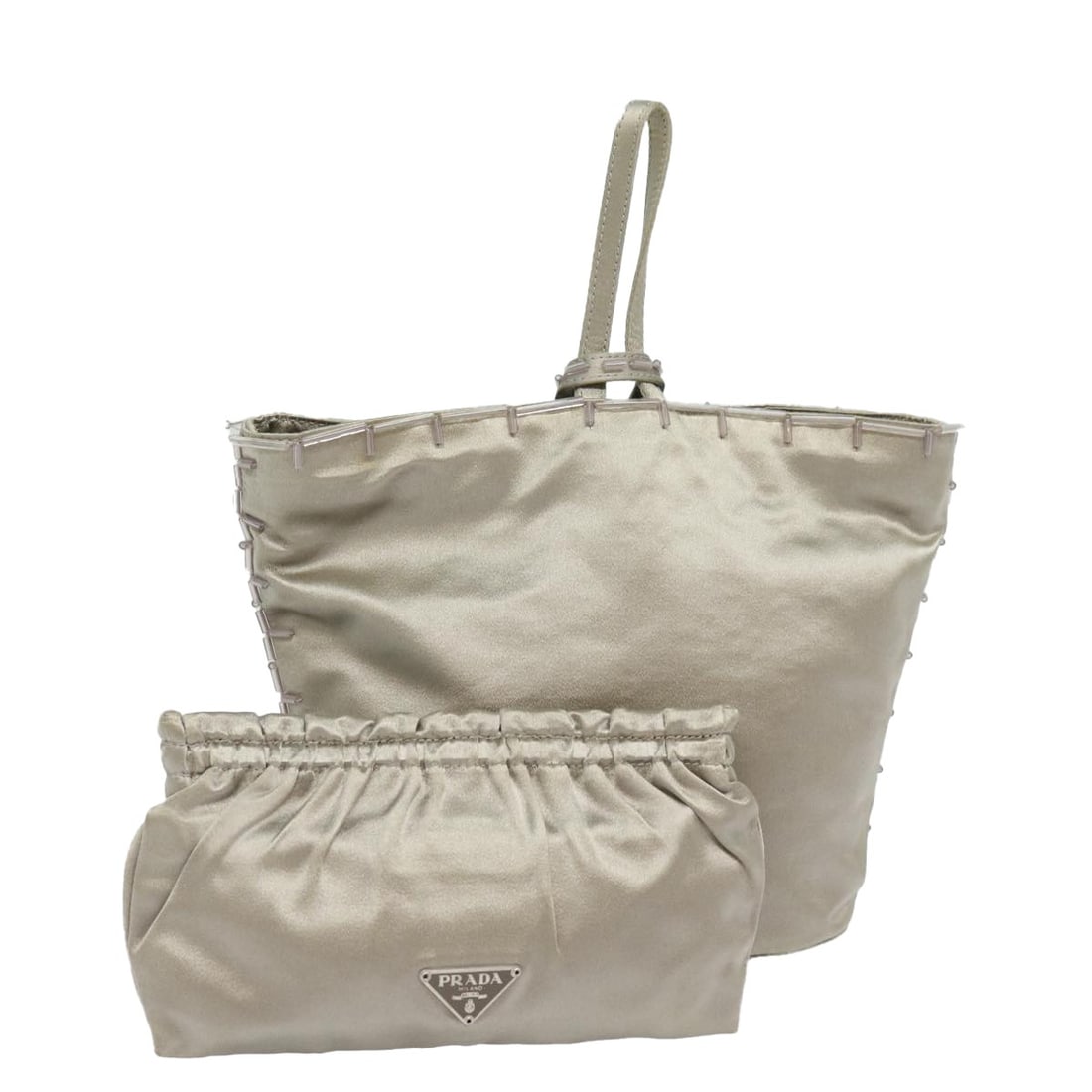 Prada Nylon Silver Handbag with Pouch Italy: Prada Nylon Silver Handbag with Pouch Italy This PRADA handbag is crafted from durable nylon in a striking silver color. Designed for women, it features a compact silhouette with approximate dimension