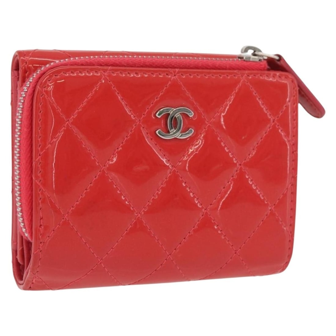 Red Patent Leather Matelasse Trifold Wallet by CHANEL Silver CC Logo: Red Patent Leather Matelasse Trifold Wallet by CHANEL Silver CC Logo This CHANEL Matelasse trifold wallet is crafted from red patent leather with silver-tone CC hardware. Designed for women, it featur