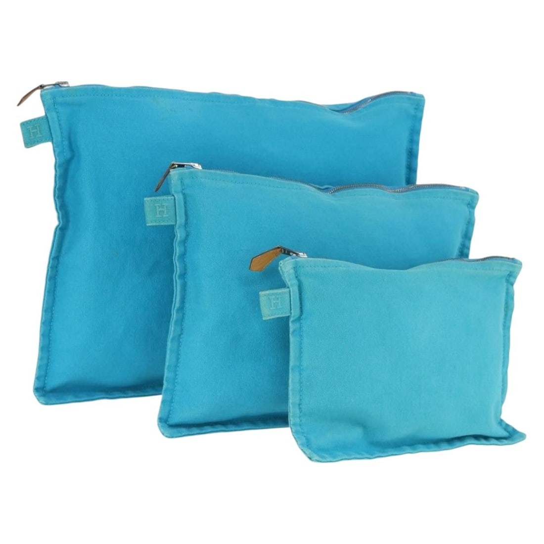 Set of 3 Light Blue Canvas Bora Bora Pouches by Hermes: Set of 3 Light Blue Canvas Bora Bora Pouches by Hermes This is a set of three Hermes Bora Bora pouches crafted from light blue canvas. Made in France, these pouches are designed for versatile use and 