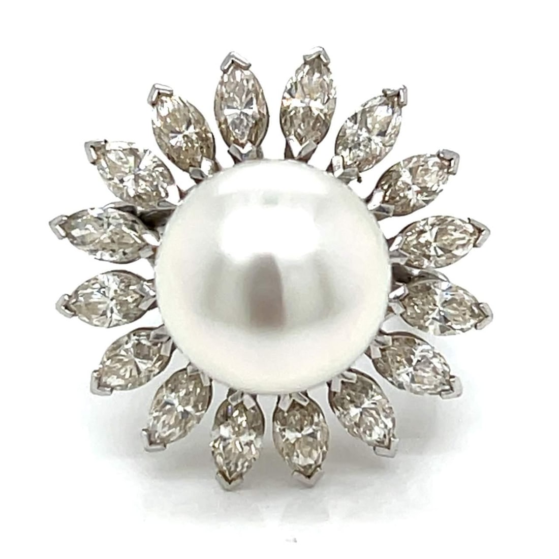 18K White Gold South Sea Pearl Diamond Ring 3.10 Ct: 18K White Gold South Sea Pearl Diamond Ring 3.10 Ct This exquisite 18K White Gold ring features a stunning 12.8mm South Sea Pearl at its center, surrounded by 16 Marquise Diamonds. The diamonds weigh 