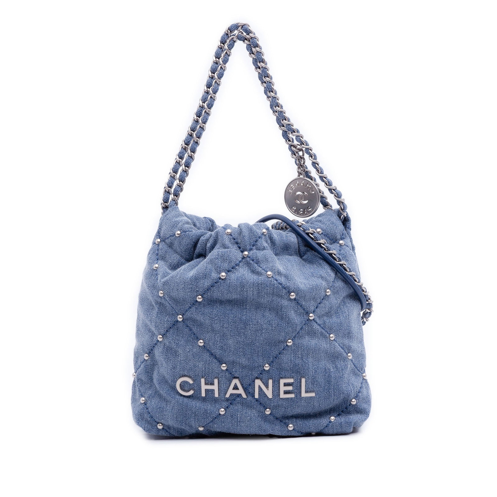 Chanel Mini 22 Blue Denim Satchel With Stud Embellishments: Chanel Mini 22 Blue Denim Satchel With Stud Embellishments This Chanel Mini Denim Studded 22 Handbag features a denim fabric body adorned with stud details, a leather-woven chain link handle, and leat