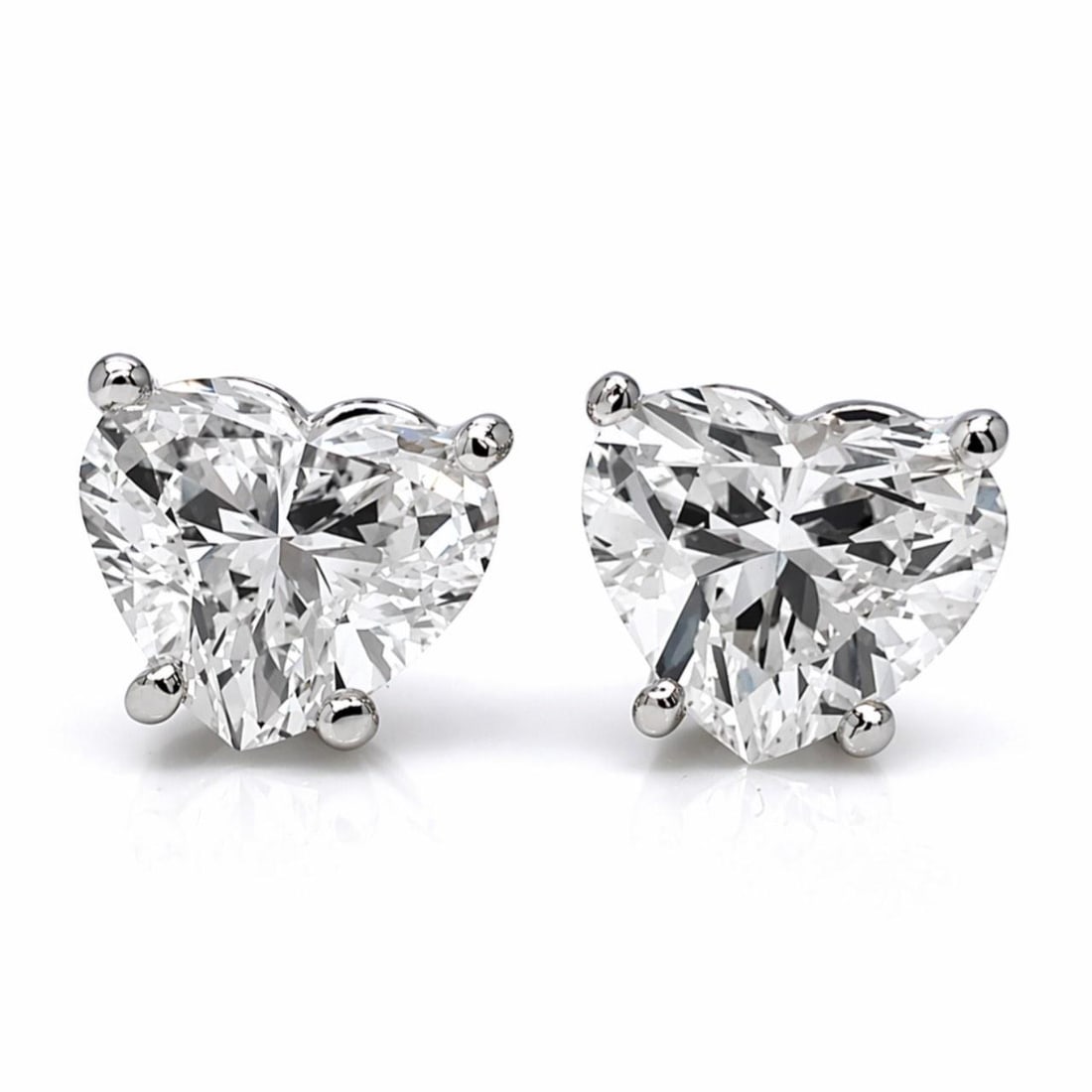 Heart-Shaped Diamond Stud Earrings in 18K White Gold 2.30 Carat: Heart-Shaped Diamond Stud Earrings in 18K White Gold 2.30 Carat These elegant stud earrings are crafted from 18K white gold and feature two heart-shaped diamonds with a total carat weight of approxima