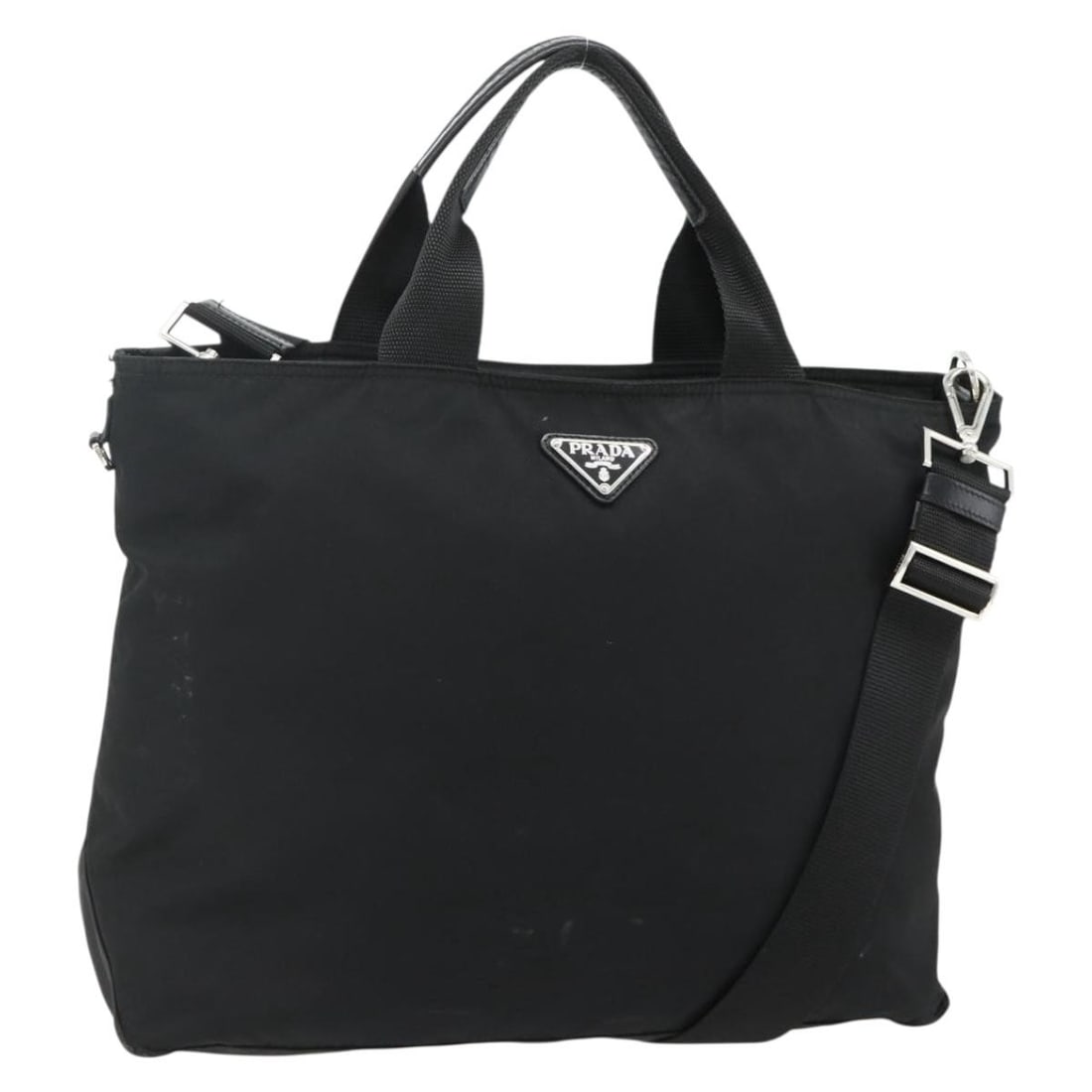 Prada Nylon Black Silver Handbag with Shoulder Strap Italy: Prada Nylon Black Silver Handbag with Shoulder Strap Italy This PRADA 2-way handbag is crafted from black nylon with silver-tone accents, offering versatile carry options with both a top handle and an